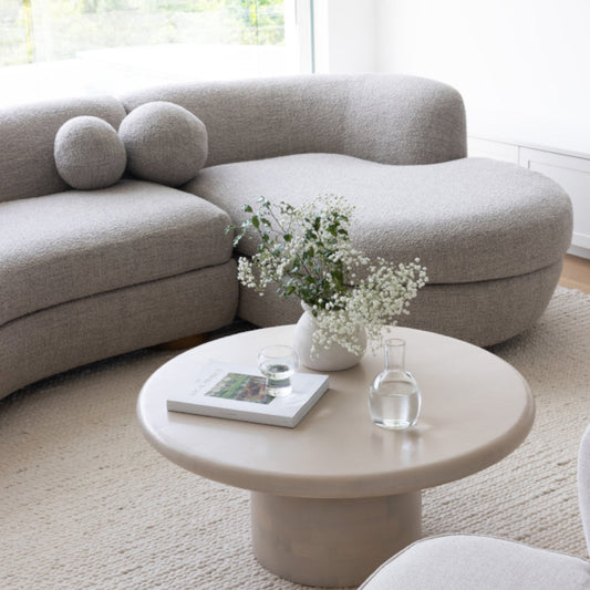 Pristine upholstered sofa in a cosy, well-lit living room