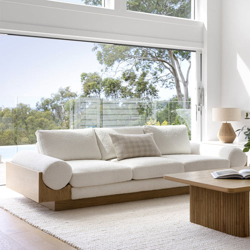 a classic white sofa bed in a minimalist living room