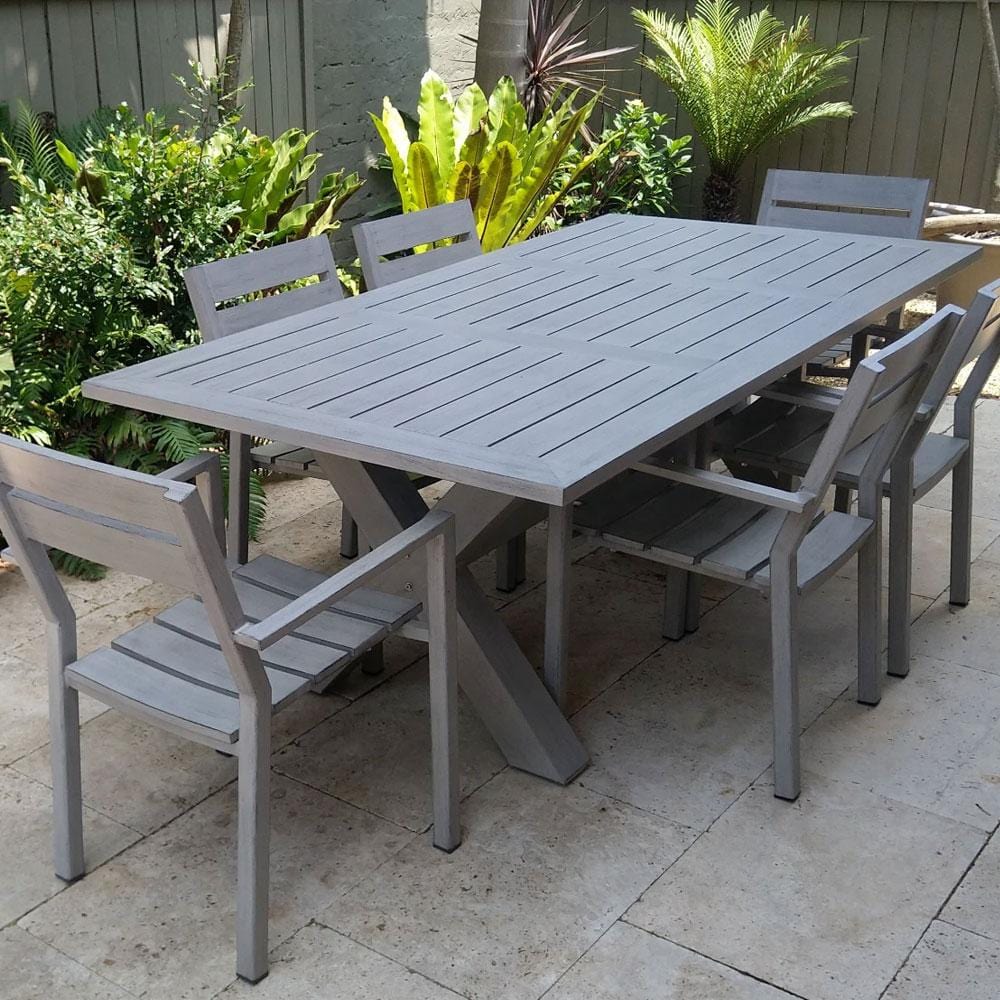 Stylish aluminium outdoor furniture set on a modern patio with potted plants